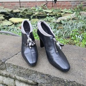 Black ankle booties with zipper charms